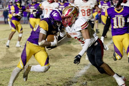 Tiger running back Dameion Hernandez takes on a defender at the five-yard line in Friday night's win over Centennial HIgh.